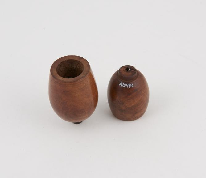 Two walnut pipe bowls with sleeves at base for insertion into