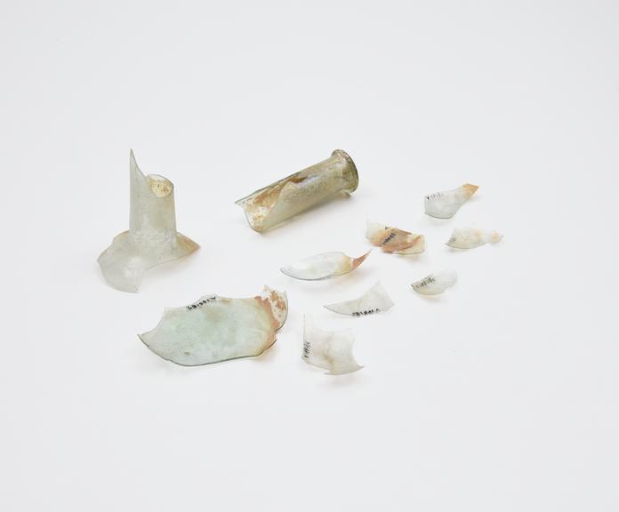 Glass unguent bottle, in fragaments, Roman, 151-300 AD