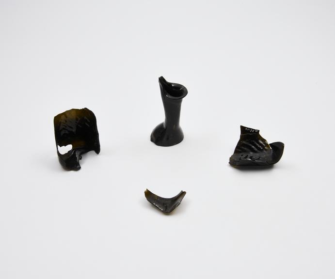 Glass flask, dark green, broken