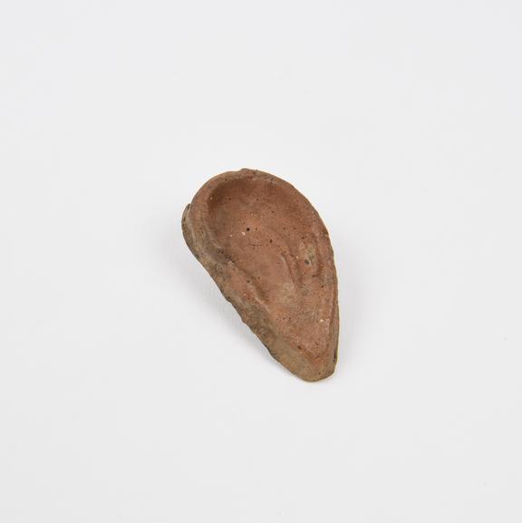 Votive left ear, terracotta, probably Roman, 200 BC to 200 AD