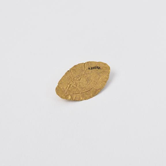 Gold votive offering, in the shape of an eye, possibly Greek