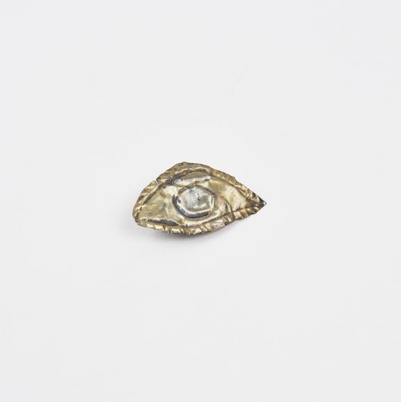 Gold votive offering, in the shape of an eye, possibly Egyptian