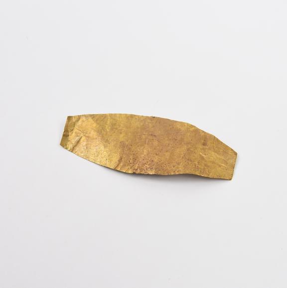 Beaten gold amulet, cigar-shaped