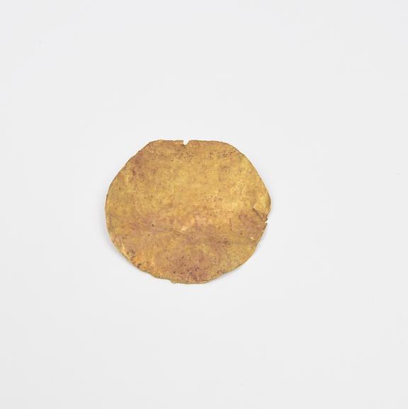 Beaten gold amulet, roughly circular