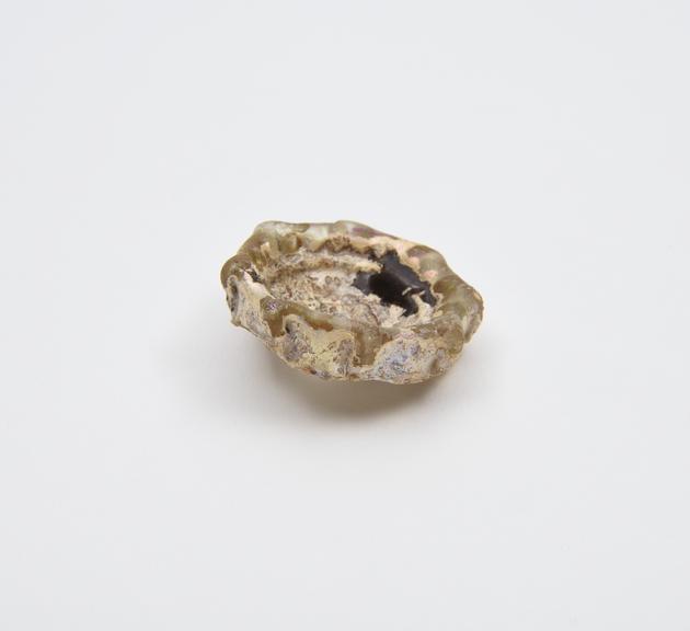 Glass base only, from an unidentified vessel, pale yellow