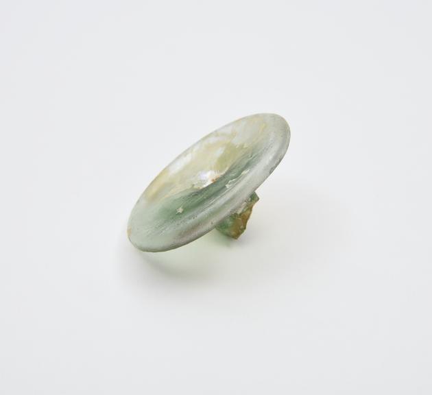 Glass base, broken from an unidentified object, Roman
