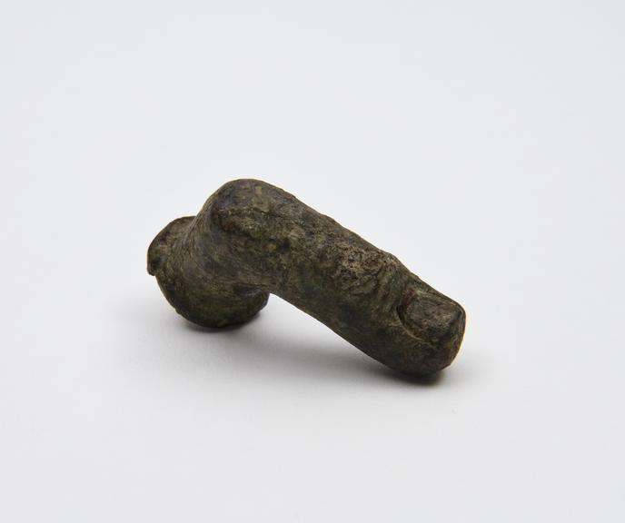 Solid bronze votive finger, bent at knuckle, probably Roman