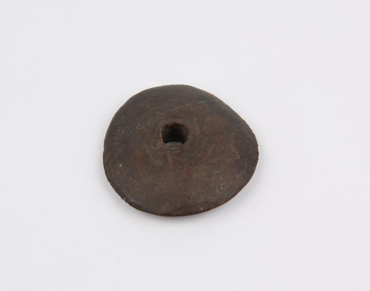 Amulet, consisting of perforated wooden disc