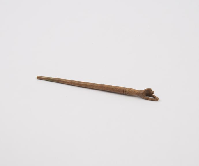 Hairpin(?), bone, with decorated head, incomplete