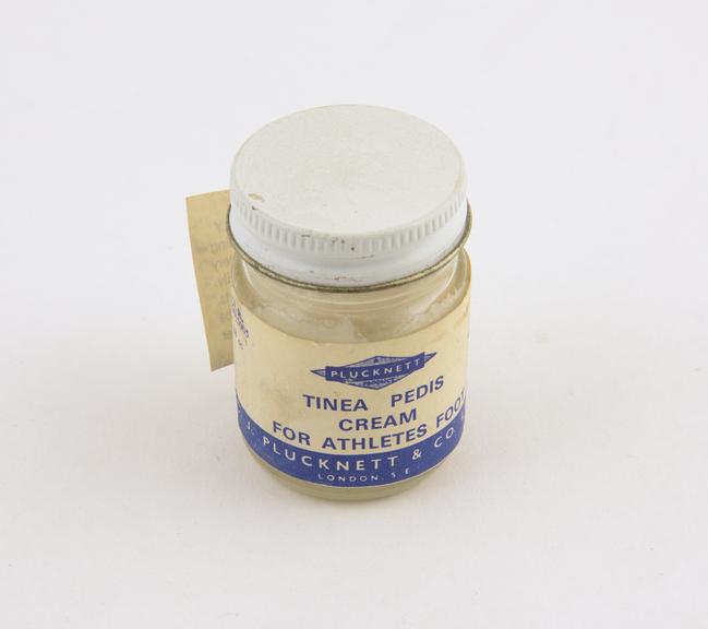 Glass pot of Tinea Pedis' cream for athletes' foot, by C.J