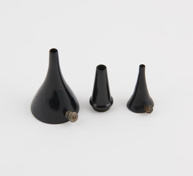 Three aural specula, black vulcanite, to examine the ear