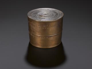 One of 13 nested cup weights in bronze