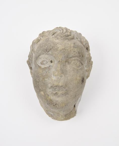 Statue of youth, head only, stone solid, probably Roman