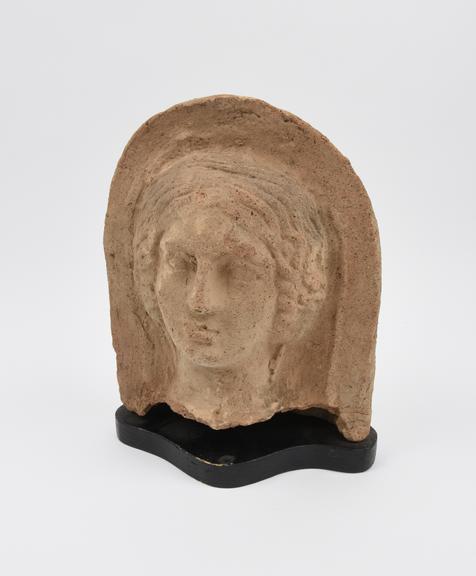 Votive female head