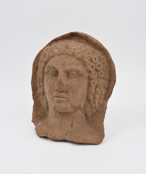 Votive female face