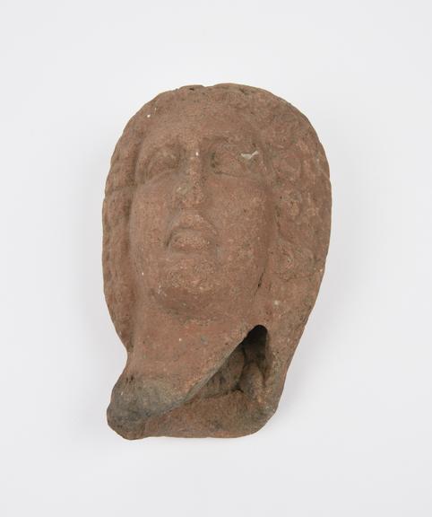 Votive female(?) head, terracotta, probably Etruscan