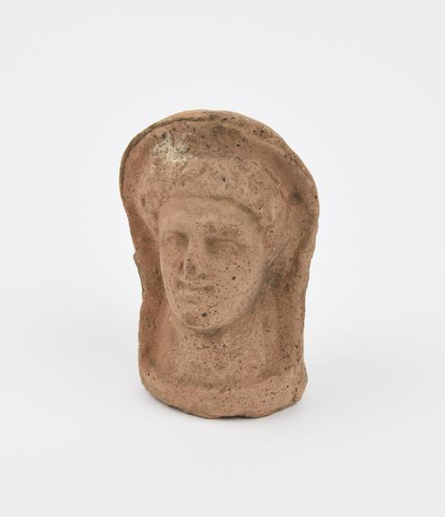 Votive head, female, terracotta, probably Roman, 200BC-200AD