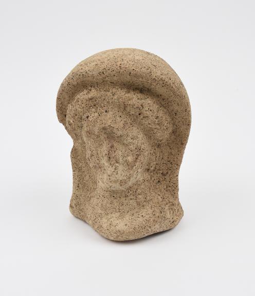 Votive female head, terracotta, hollow, open at base, hooded