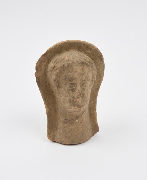 Votive head, female, terracotta, probably Roman, 200BC-200AD