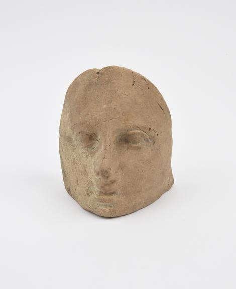 Votive female(?) face, terracotta, concave mask