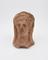 Votive male head, terracotta, hollow, open at base