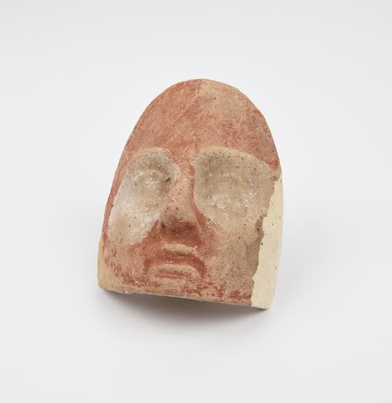 Roman votive terracotta face.