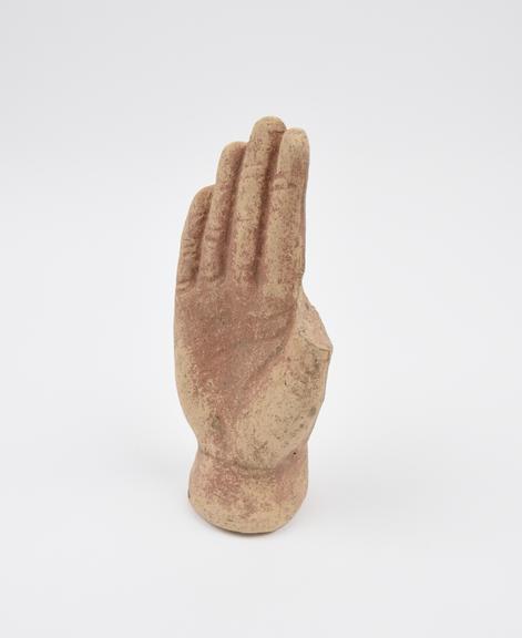 Votive right hand, stylization, terracotta, hollow