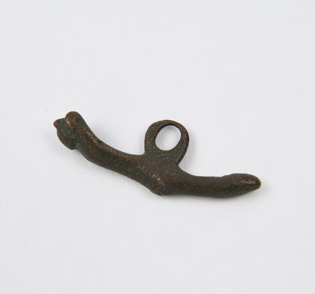 Cast bronze amuletic pendant, anvil like