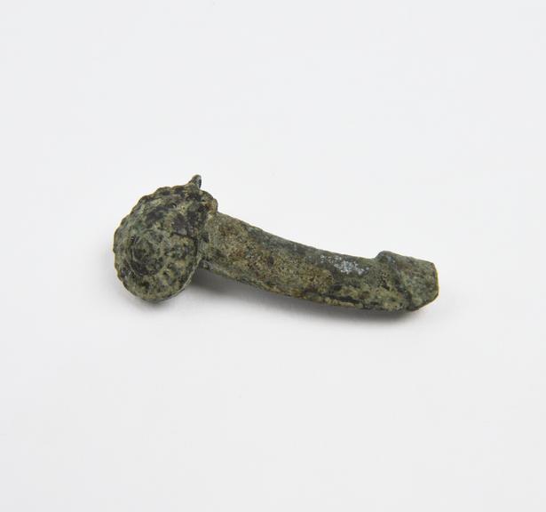 Solid bronze amulet in form of priapus emerging like snail from shell