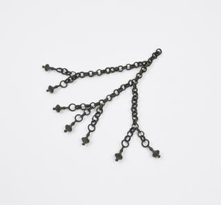Bronze flail (?), consisting of chains with knobs