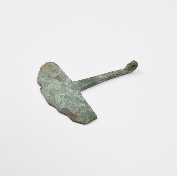 Crescent-shaped razor with long thin handle, bronze, Etruscan