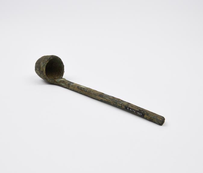 Bronze ladle, handle possibly damaged, encrusted