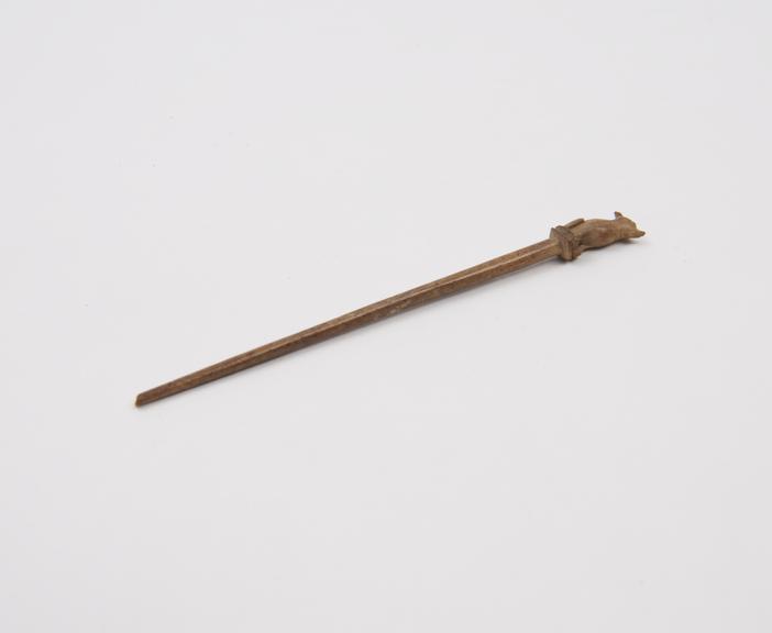 Bone hairpin (?), with decorated head