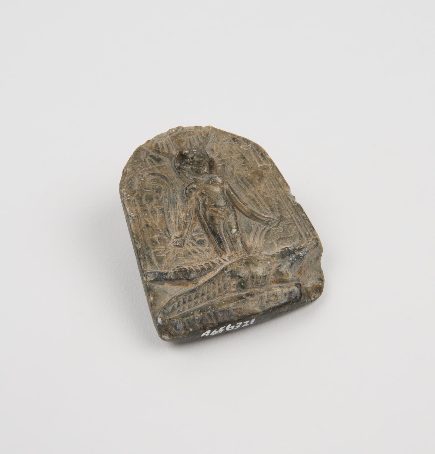 Relief tablet showing human and crocodile | Science Museum Group Collection