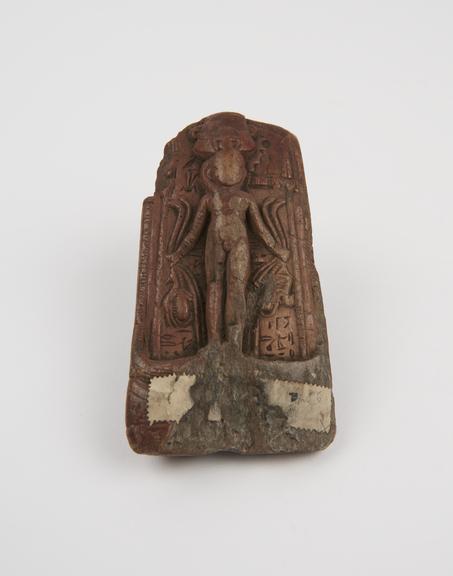 Soapstone relielf tablet depicting human figure with headdress