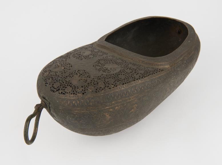 Brass beggin bowl(?), shoe shaped with 2 handles