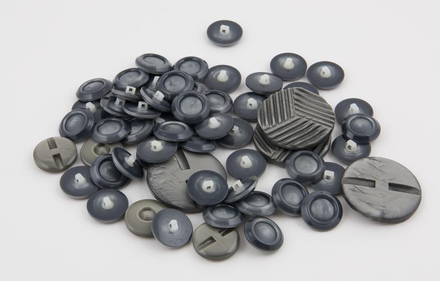 Polished casein buttons coloured grey, shadow pearl