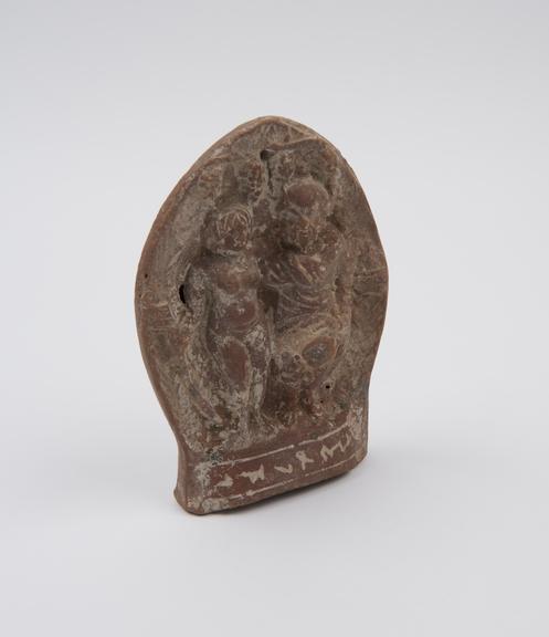 Hollow arch-shaped plaque with figures of male and female moulded (plaque)