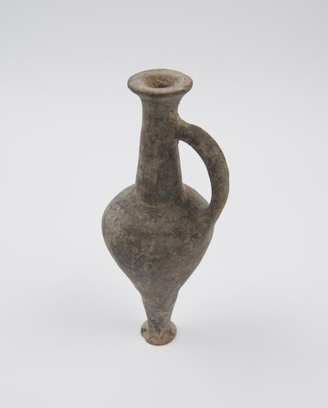 Earthenware bottle with long neck and loop handle