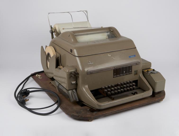 Teleprinter with tape punch and reader