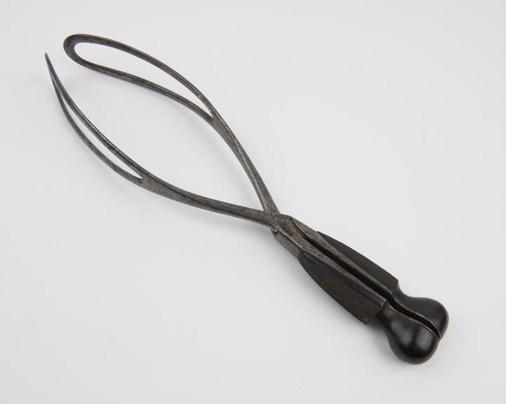 Forceps, obstetrical, steel and ebony, by W.B