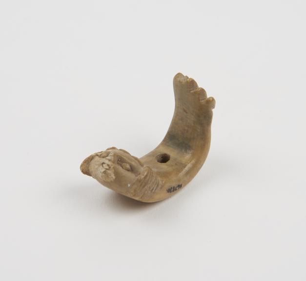 Ivory(?) pendant, amuletic, crescent-shaped