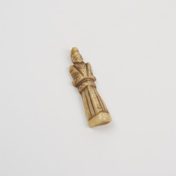 Carved bone(?) pendant, in human form