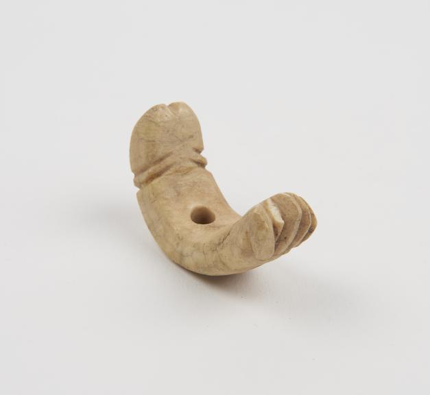 Bone pendant, crescent-shaped, amuletic and phallic