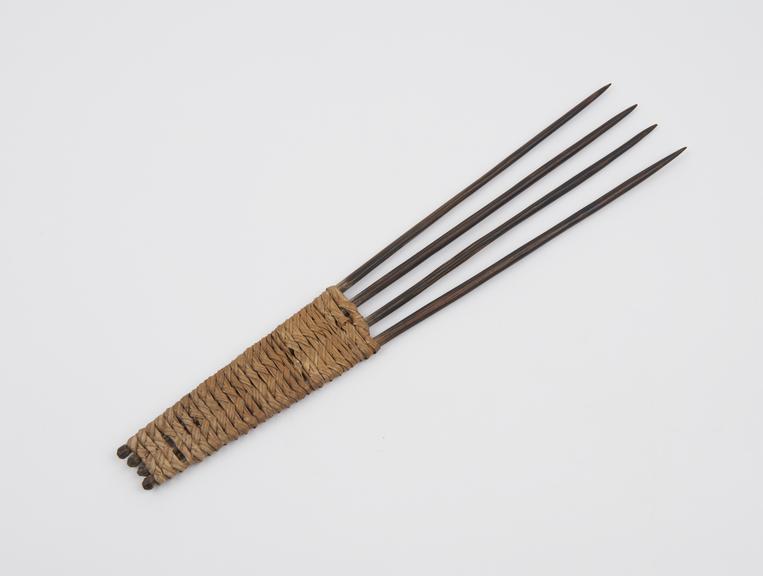 4-pronged comb with woven fibre handle from New Hebrides