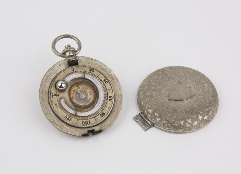 Pocket thermometer (mercury in glass) and compass; range -5 deg