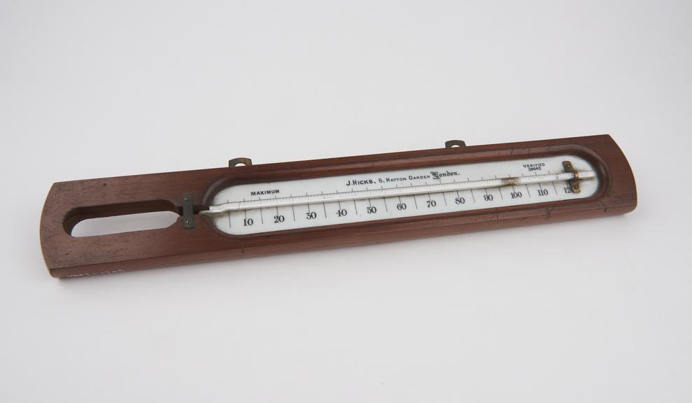 Mercury-in-glass thermometer mounted on wood, bulb missing