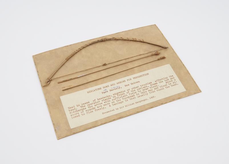 Miniature bow made of coconut wood, for venesection