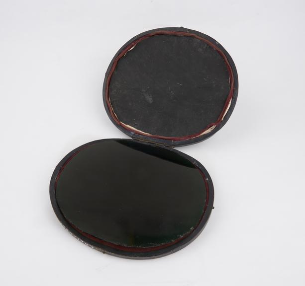 Claude Lorrain mirror of dark Green glass in black leather case