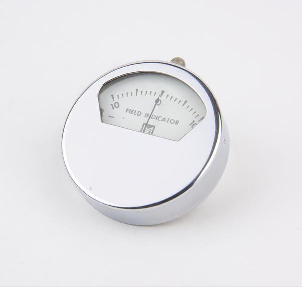 Magnetic field indicator in chrome-plated metal case by the